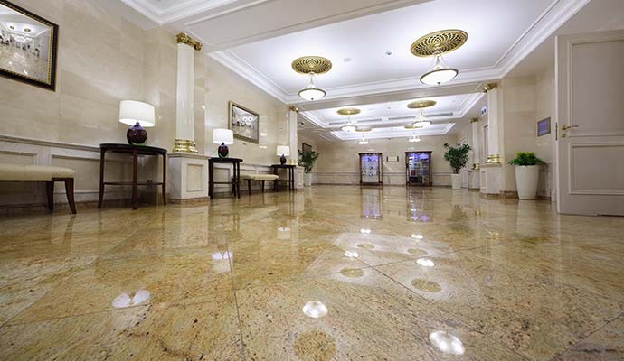 A high-angle view of an elegant lobby featuring polished granite floor