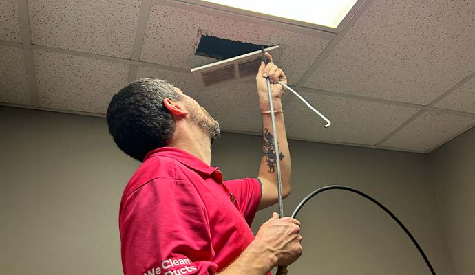 A professional cleaning air duct vent