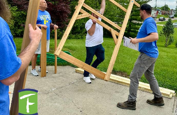 Roc Solid Playset Build with Volunteers and a Little Superhero