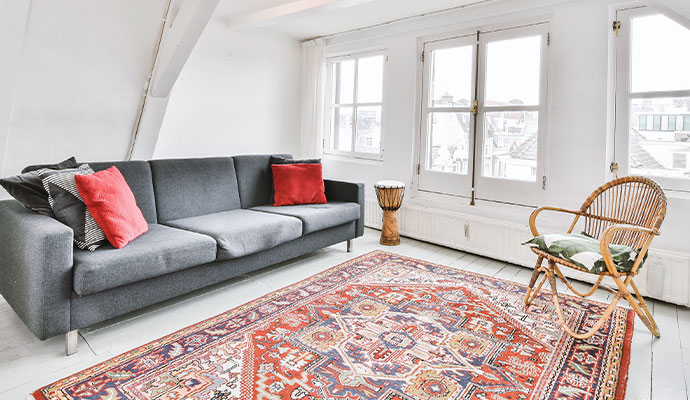 Traditional Afghan rug placed in a modern living room