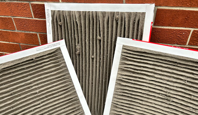 Dirty air filters clogged with dust and debris