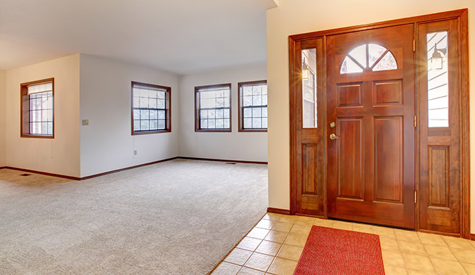A carpeted open-concept living room