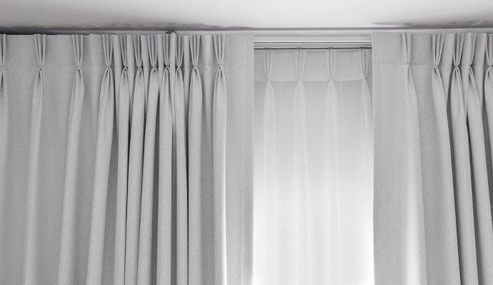 Clean drapery hanging on window