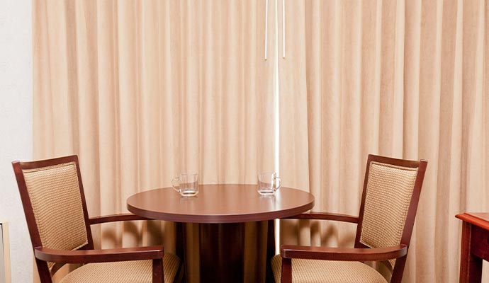 Hanging ceiling-to-floor drapery