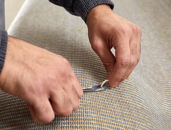 Professional carpet repair using equipment