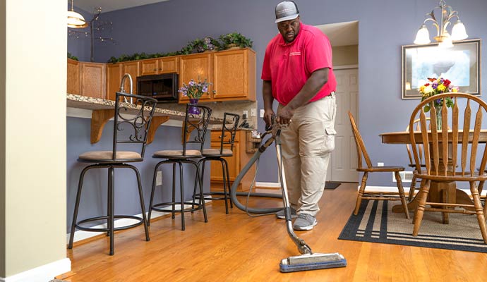 Professional floor cleaning service using equipment