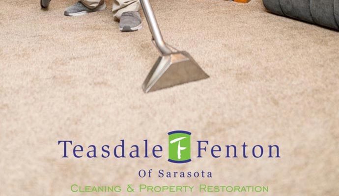 worker cleaning carpet