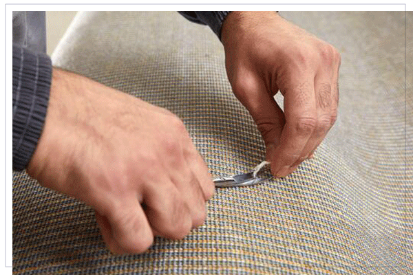 Worker repairing carpet