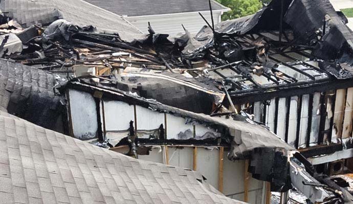 Charred roof trusses after fire damage