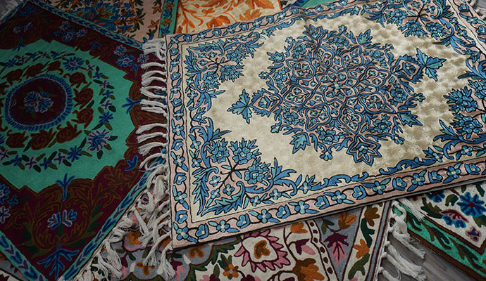 Collection of colorful Indian rugs with traditional patterns