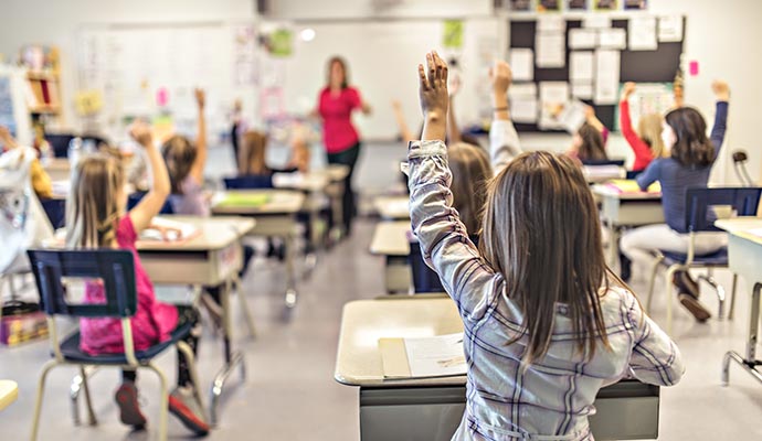 Clean classroom interior with students inside