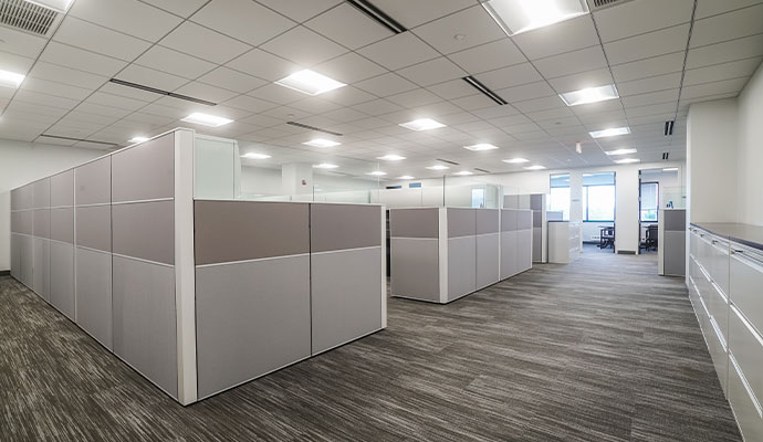 Clean modern workspace with gray cubicle partitions