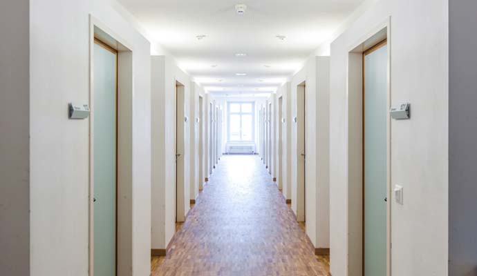 Bright interior hallway corridor in a multi-tenant building