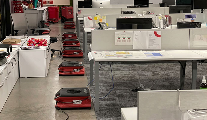 Commercial water damage restoration service with air movers