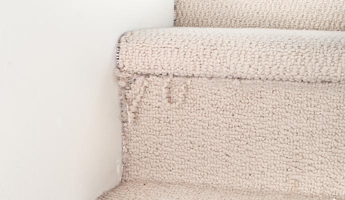 Frayed stair carpet edge