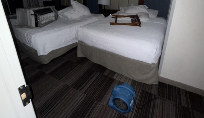 Hotel room set up with professional drying equipment to address water damage