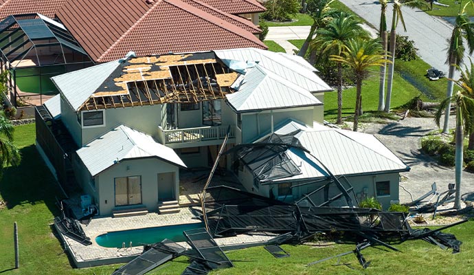 Hurricane damaged residential house roof