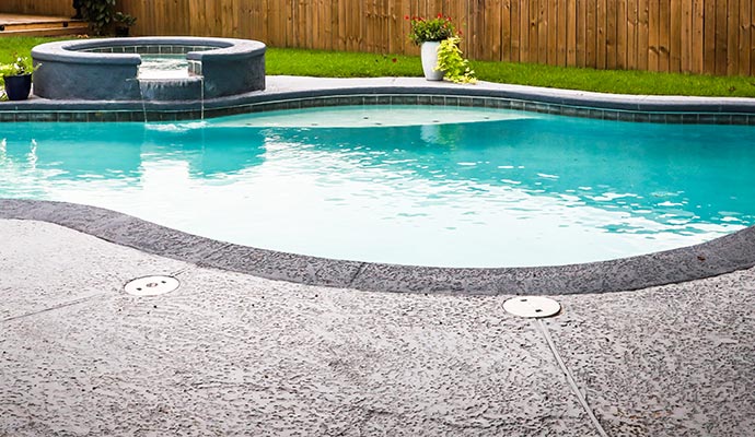 Concrete pool floor that has been cleaned