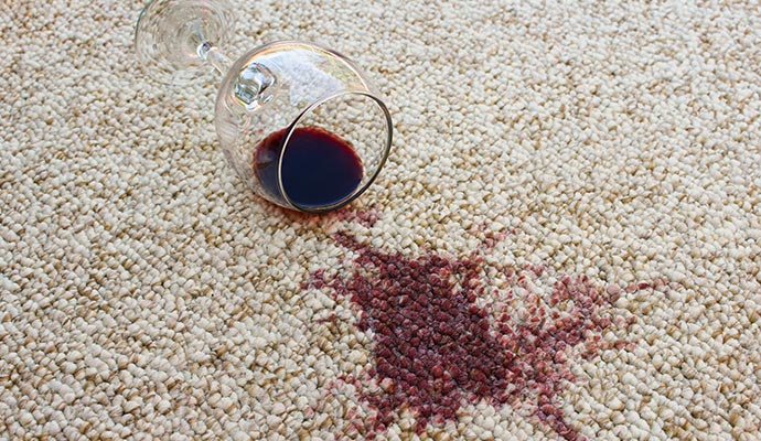 Red wine stain on beige carpet