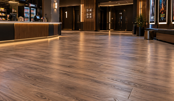 Smooth laminate wood flooring in a cinema lobby