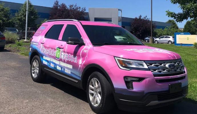 A bright pink Teasdale Fenton service vehicle.