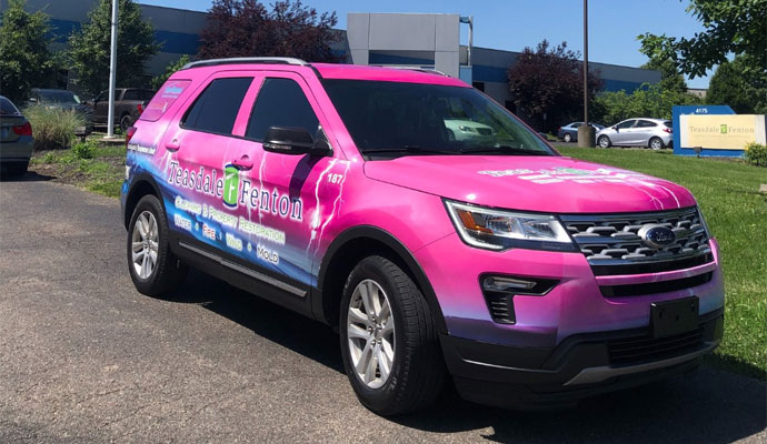 Teasdale Fenton service vehicle parked outside