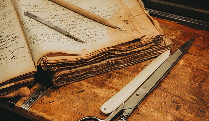 Damaged book with restoration equipment on the side