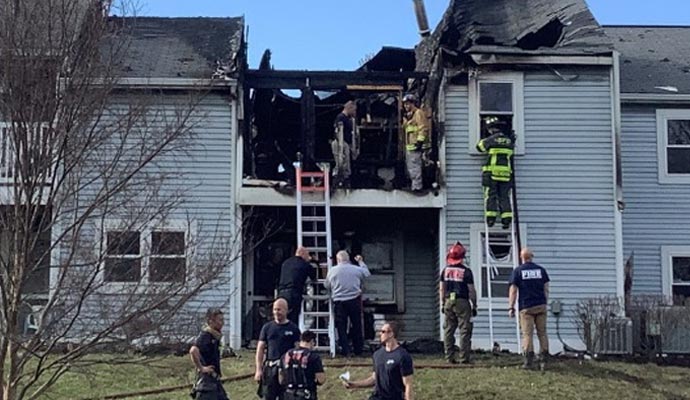 a team performing fire damage restoration service in a fire
          damaged house