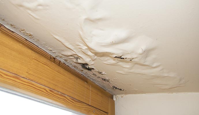 Water damaged ceiling due to roof leak