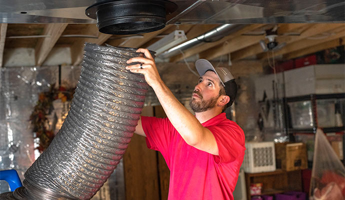 worker setting commercial air duct in Cincinnati